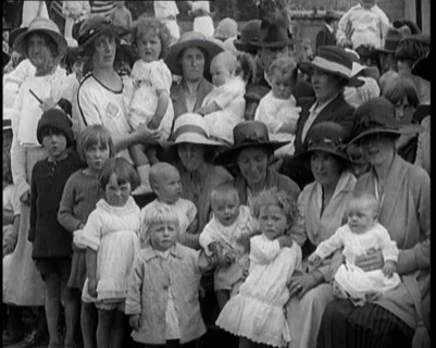 British Mothers Sitting With Their Babies on Their Laps at a Baby Show, 1920. Creator: British Pathe Ltd.