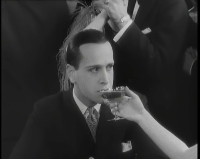 Scene from the Film 'Champagne': Betty Balfour in a Nightclub Drinking Champagne and Giving...,1920s Creator: British Pathe Ltd.