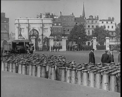 Milk Churns Lining the Street, 1926. Creator: British Pathe Ltd.