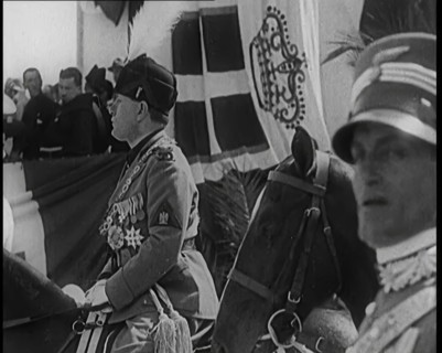 Benito Mussolini in Ceremonial Uniform on Horseback Reviewing Troops, 1926. Creator: British Pathe Ltd.