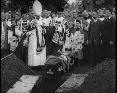 A Priest Waving Incense Over the Coffin of Terence MacSwiney During His Burial, 1920. Creator: British Pathe Ltd.
