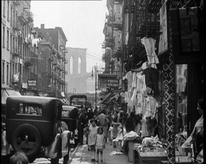 Street View of Street Market Selling Clothes in New York City, 1932. Creator: British Pathe Ltd.