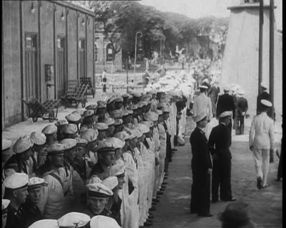 Male German Navy Crew Lined up in Front of a Building in Montevideo, 1939. Creator: British Pathe Ltd.
