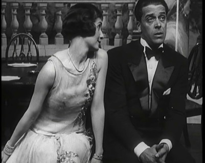 Jack Buchanan and June Knight Sitting on a Bench Together. Buchanan Looking Uncomfortable...,1920s Creator: British Pathe Ltd.
