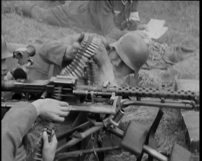 Two German Soldiers Firing a Machine Gun..., 1937. Creator: British Pathe Ltd.