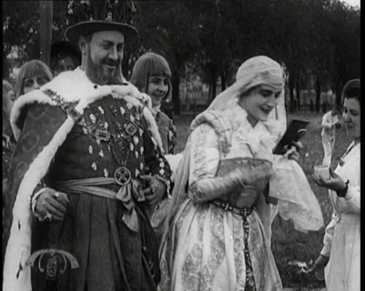The Actor Henny Porten Dressed in Period Costume Putting on Make up from a Powder Compact..., 1920s. Creator: British Pathe Ltd.