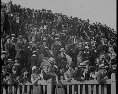 A Group of People Waving As Old Fashioned Looking Hot Air Balloons Are Taking Off the Ground, 1920s. Creator: British Pathe Ltd.