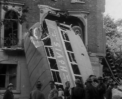 People Standing Next to a Bombed Out Bus, 1940. Creator: British Pathe Ltd.