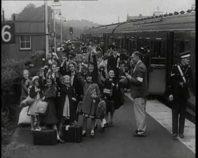 British Male and Female Evacuees on the Platform of a Small Station in the British Country..., 1939. Creator: British Pathe Ltd.