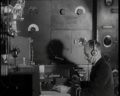 Interior of a Ship at Sea With Man at Work Operating a Communication System, 1920s. Creator: British Pathe Ltd.