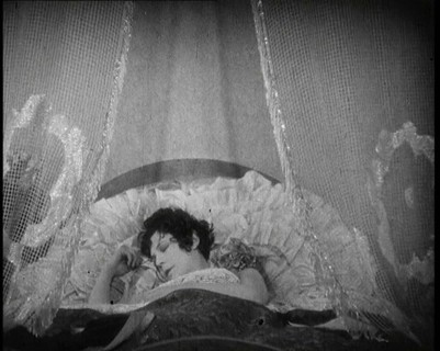 Scene from a 1920s Film. A Female Actor Sleeping in a Bed, 1920s. Creator: British Pathe Ltd.
