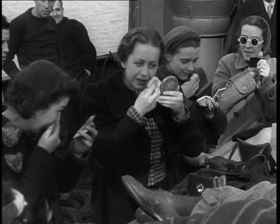 Dutch Refugees Fleeing Aboard Ships in the Netherlands. Women Are Applying Makeup, 1940. Creator: British Pathe Ltd.