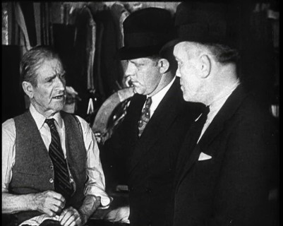 Elderly Male Civilian Being Threatened For Protection Money By Two Male Civilians, 1932. Creator: British Pathe Ltd.