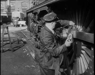 A Man Doing Maintenance Work on a Train Carriage, 1940. Creator: British Pathe Ltd.