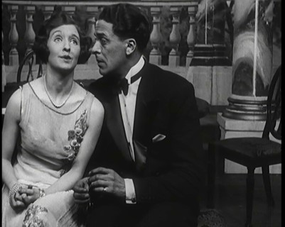 Jack Buchanan and June Knight Sitting on a Bench Together. Buchanan Looking Uncomfortable...,1920s Creator: British Pathe Ltd.