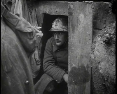 A Male French Soldier Sitting in a Doorway Dug into the Side of a Trench, 1939. Creator: British Pathe Ltd.