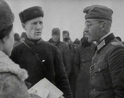 Two Russian Soldiers Talking to a German Prisoner of War, 1941. Creator: British Pathe Ltd.
