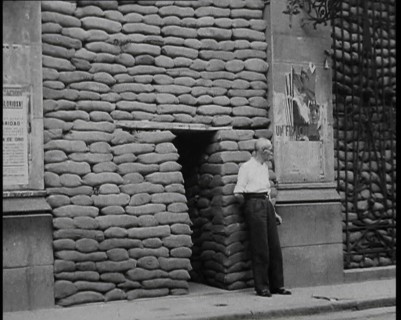 A Man Standing Outside the Frontage of a Building Obscured By Sandbags Next To an..., 1937. Creator: British Pathe Ltd.