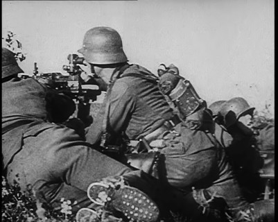 German Soldiers Firing from Cover at Dunkirk, 1940. Creator: British Pathe Ltd.