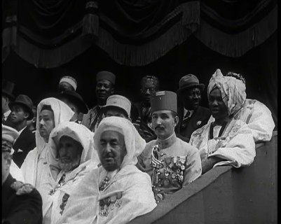 Dignitaries and Representatives from Various African Countries Sitting in Raked Seats at a..., 1939. Creator: British Pathe Ltd.