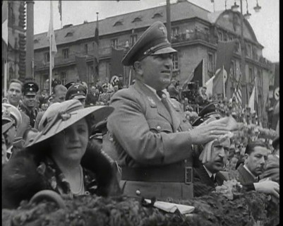Close up of a German Nazi Party Official in a VIP Section of a Stand With Others Clapping..., 1938. Creator: British Pathe Ltd.
