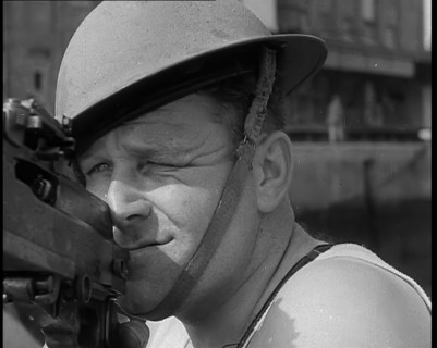 British Sailors Mounting Machine Guns To Small Boats for the Dunkirk Evacuation, 1940. Creator: British Pathe Ltd.