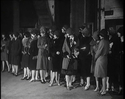 The Producer Julian Wylie Inspecting Young Prospective Female Stage Performers Standing..., 1920s. Creator: British Pathe Ltd.