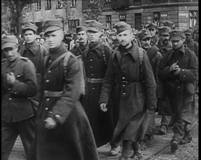 Male Polish Soldiers Walking Along a Warsaw Street, 1939. Creator: British Pathe Ltd.