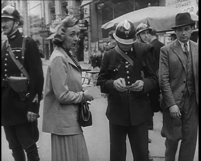 French Police Checking People's Papers Outside a Cafe in Paris, 1940. Creator: British Pathe Ltd.