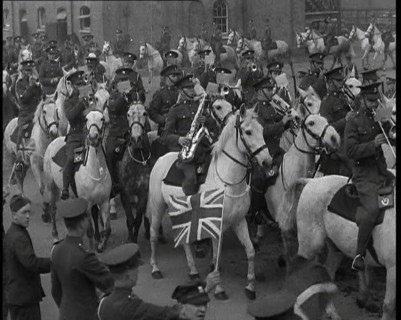 British Army Band on Horseback Parading Down a Street, 1937. Creator: British Pathe Ltd.