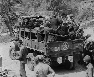 Italian Civilians Being Driven off in a US Army Truck, 1943-1944. Creator: British Pathe Ltd.