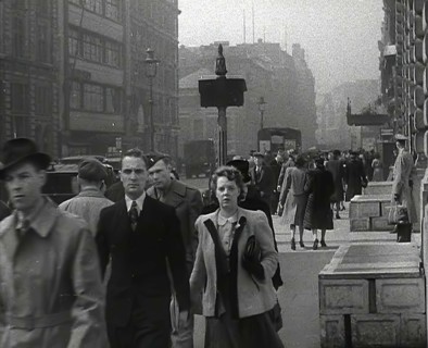 Civilians Walking Down a Street, 1942. Creator: British Pathe Ltd.