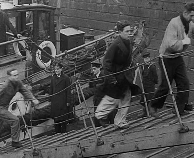 Crew of the Destroyed Bismarck Walking up a Gangplank Into a British Ship, 1943. Creator: British Pathe Ltd.