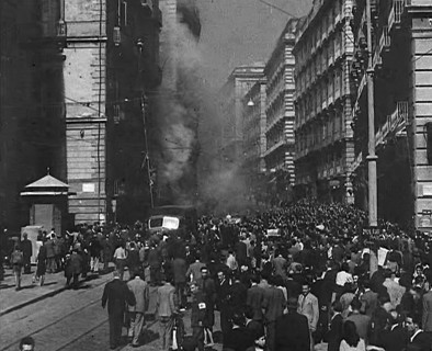Italian Civilians Moving Slowly Through Bomb-Damaged Naples, 1943-1944. Creator: British Pathe Ltd.