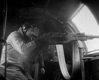 Actor Clark Gable Firing a Machine Gun Out of a Warplane, 1943-1944. Creator: British Pathe Ltd.