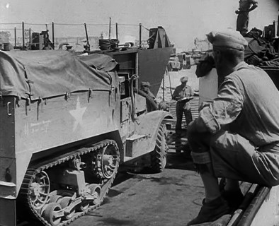 A Supply Truck Backing Into a Supply Depot, 1943. Creator: British Pathe Ltd.