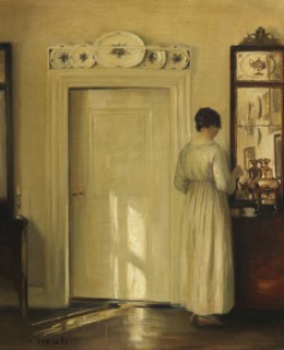 Interior with woman making tea, c1900-1910. Creator: Holsøe; Carl (1863-1935).