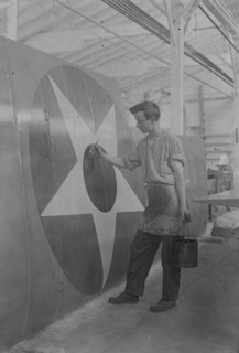 Putting U.S. Emblem on plane, between c1915 and c1920. Creator: Bain News Service.