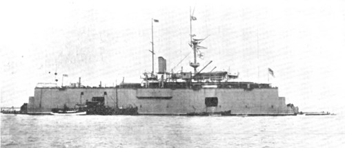 A battle-ship docked on the water: H.M.S. "Sans Pareil" on a floating-dock in the Tyne, 1909. Creator: L.N.A..