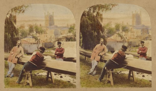 Three men at a table outside, castle in background, 1857-1862. Creator: Roger Fenton.