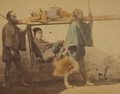 Japanese woman in a sedan, being carried by two men, 1865-1875. Creator: Unknown.