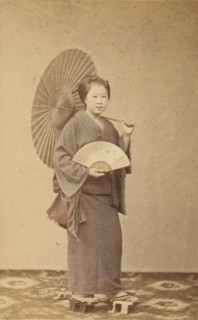 Woman with parasol and fan, about 1868. Creator: Felice Beato.