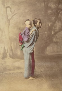 Japanese woman carrying her baby on her back, 1868-1880. Creator: Felice Beato.