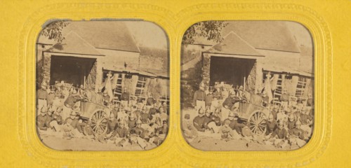 Group of firemen posed outside in front of station with wagon, 1855-1865. Creator: Jules Marinier.