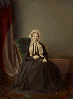 Seated woman in bonnet, about 1850. Creator: Unknown.
