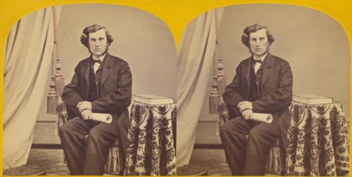 Unidentified man with muttonchops seated, holding a rolled paper, about 1860. Creator: Unknown.