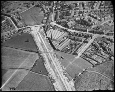 Hazelhurst Cotton Mill and the East Lancashire Road (A580)  under construction, Hazelhurst, c1930s. Creator: Arthur William Hobart.
