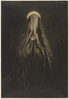 Portrait of a Woman Wearing a Long, Veiled Hat, about 1922. Creator: Francis Joseph Bruguiere.