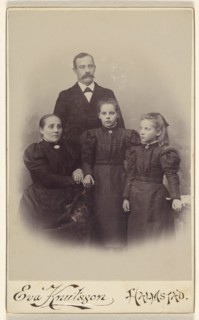 Family portrait: mother, father, and two daughters, 1895-1912. Creator: Eva Knutsson.