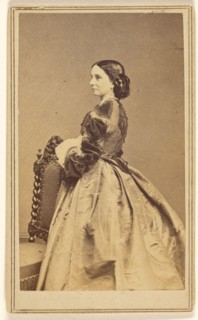 Full-length portrait of an unidentified woman in profile, 1864. Creator: Charles De Forest Fredricks.